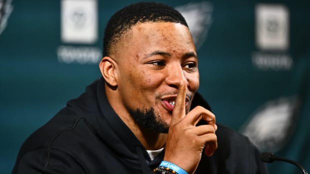 Eagles running back Saquon Barkley shushes his daughter in the audience.